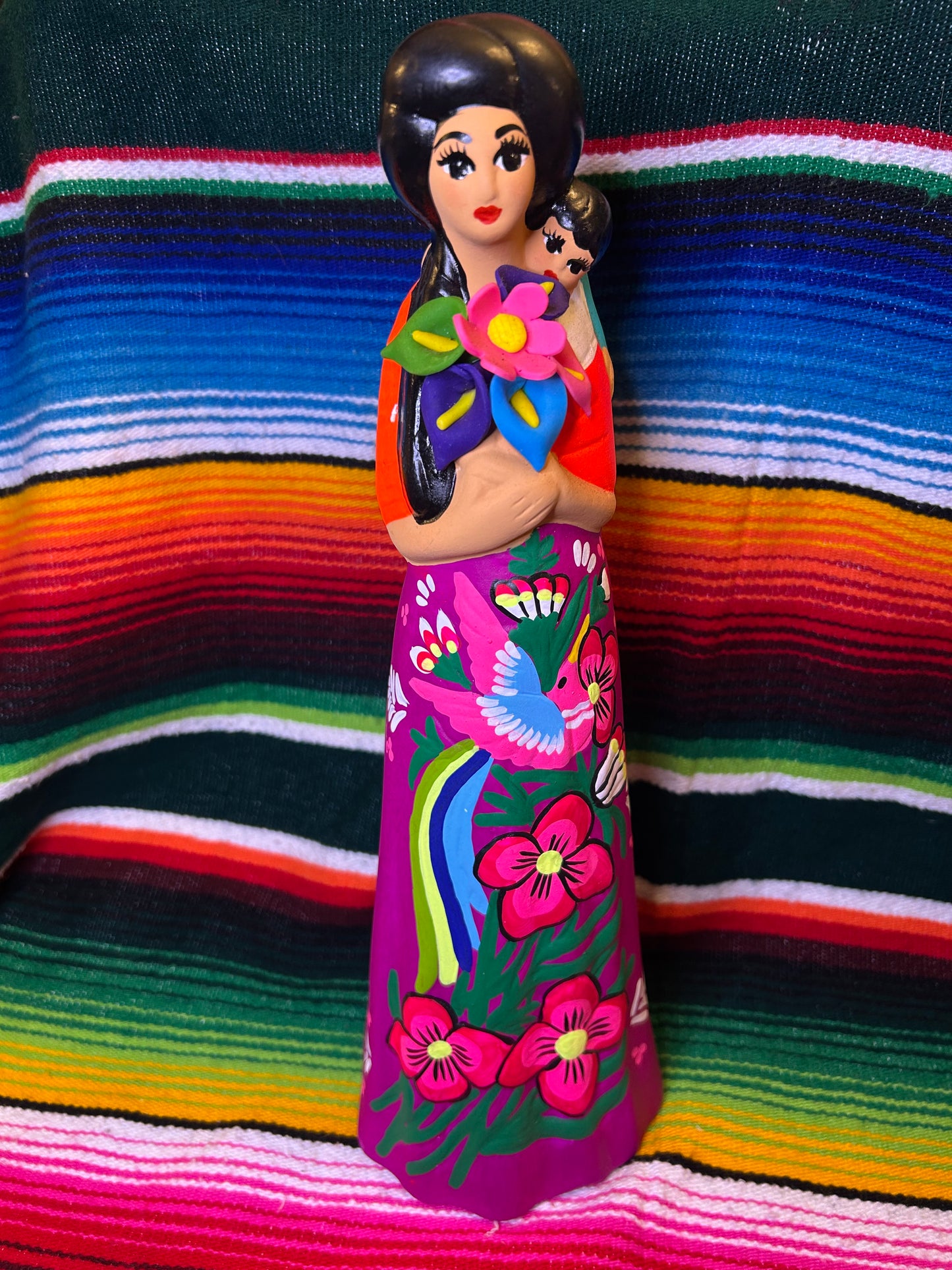 Hand painted Mexican folk art woman with child.