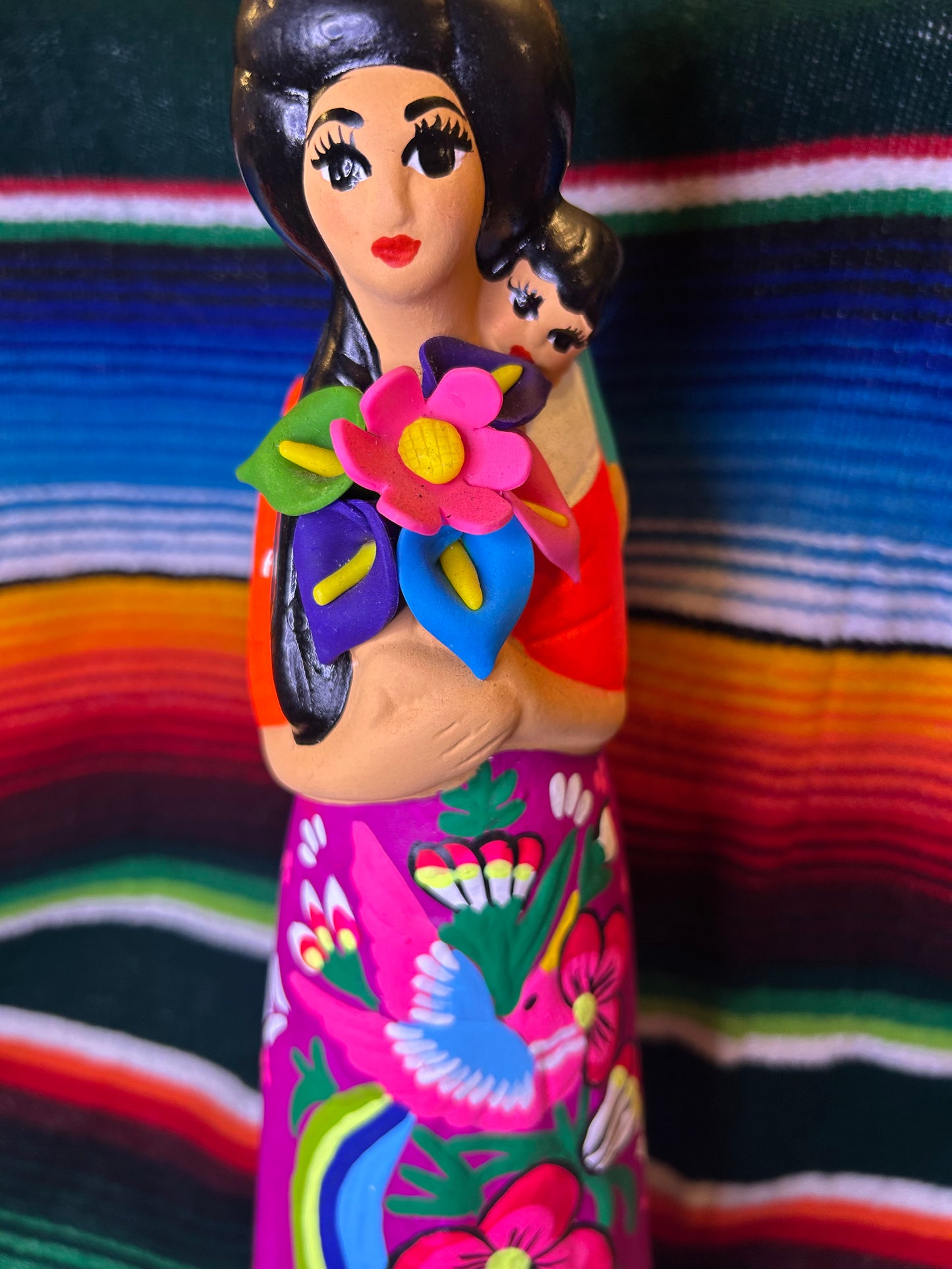 Hand painted Mexican folk art woman with child.