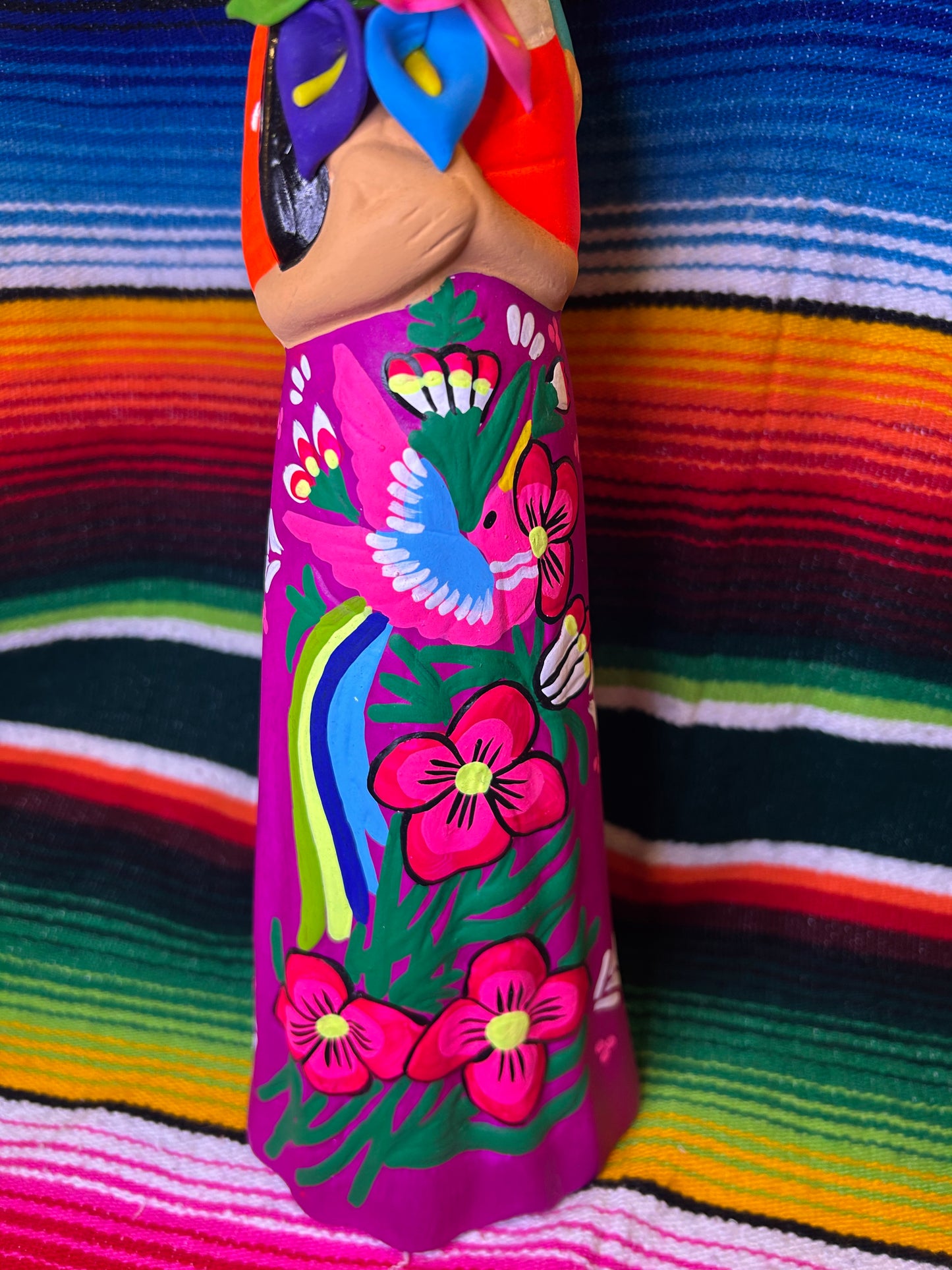 Hand painted Mexican folk art woman with child.